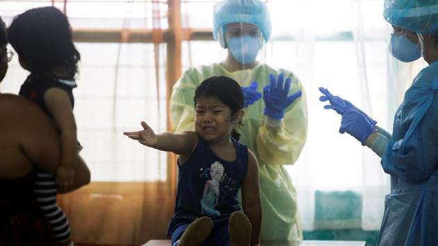 A child reacts before health workers take of a swab test for the coronavirus disease (COVID-19), in San Jose, Costa Rica June 26, 2020. (Representational image)(REUTERS) A child reacts before health workers take of a swab test for the coronavirus disease (COVID-19), in San Jose, Costa Rica June 26, 2020. (Representational image)(REUTERS)