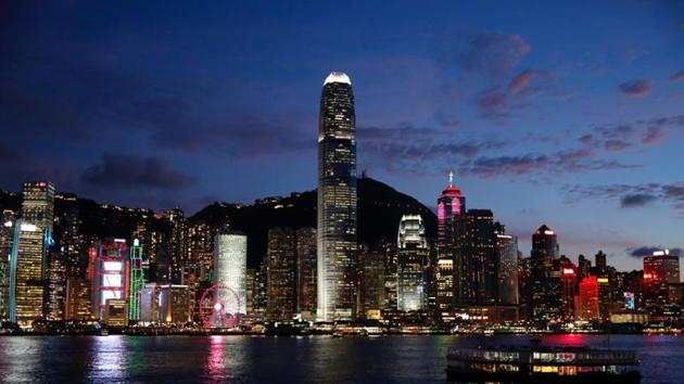 A Star Ferry boat crosses Victoria Harbour in front of a skyline of buildings during sunset, as a meeting on national security legislation takes place in Hong Kong, China.(REUTERS)