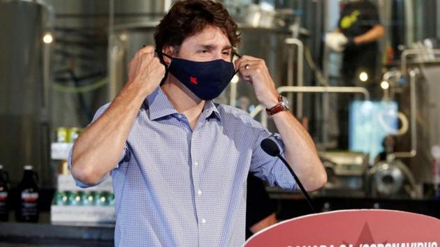 Canada's Prime Minister Justin Trudeau removes his face mask as he visits the Big Rig Brewery, which utilises the Canada Emergency Wage Subsidy given to businesses affected by the coronavirus disease outbreak, in Ontario’s Kanata on June 26.(Reuters Photo) Canada's Prime Minister Justin Trudeau removes his face mask as he visits the Big Rig Brewery, which utilises the Canada Emergency Wage Subsidy given to businesses affected by the coronavirus disease outbreak, in Ontario’s Kanata on June 26.(Reuters Photo)