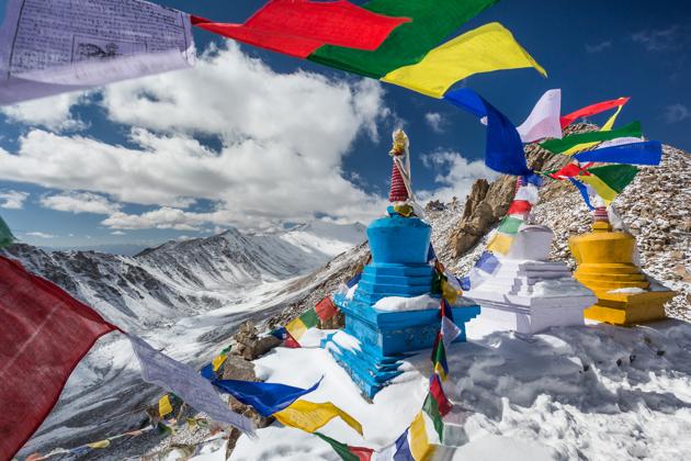 Prayer flags and stupas in the eastern Himalayas. (Shutterstock) Prayer flags and stupas in the eastern Himalayas. (Shutterstock)