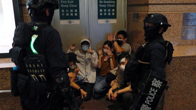 People detained by riot police during a march against national security law at the anniversary of Hong Kong's handover to China from Britain in Hong Kong, China July 1, 2020. (Reuters photo) People detained by riot police during a march against national security law at the anniversary of Hong Kong's handover to China from Britain in Hong Kong, China July 1, 2020. (Reuters photo)