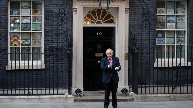 Britain's Prime Minister Boris Johnson applauds outside 10 Downing Street in London, Britain. (REUTERS) Britain's Prime Minister Boris Johnson applauds outside 10 Downing Street in London, Britain. (REUTERS)