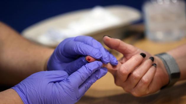 A worker takes a blood sample from a woman during a clinical trial of tests for the coronavirus disease (COVID-19) antibodies. (Representational) (REUTERS)