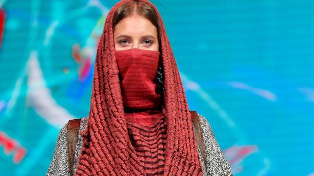 A model presents a creation Desert call by Belarusian designers Alina Loiko and Yuliya Shved during a show at the festival and contest Fashion Mill, amid the coronavirus disease (COVID-19) outbreak, in Minsk, Belarus June 30, 2020. (REUTERS/Vasily Fedosenko) A model presents a creation Desert call by Belarusian designers Alina Loiko and Yuliya Shved during a show at the festival and contest Fashion Mill, amid the coronavirus disease (COVID-19) outbreak, in Minsk, Belarus June 30, 2020. (REUTERS/Vasily Fedosenko)