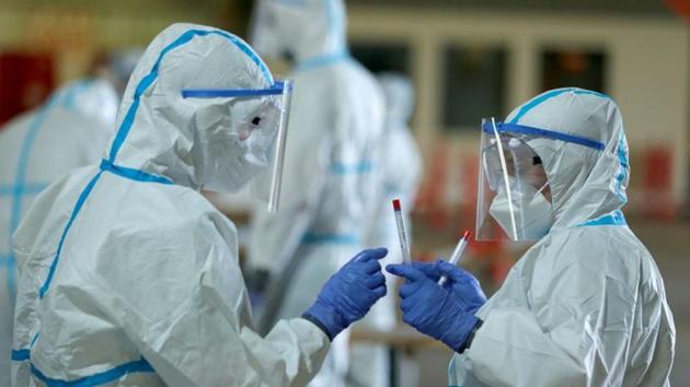 Medical personnel work at a drive-in testing site at an out-of-service aircraft hangar at Guetersloh Airport following an outbreak of the coronavirus disease (COVID-19) in Guetersloh, Germany, Germany. (Representational) (REUTERS) Medical personnel work at a drive-in testing site at an out-of-service aircraft hangar at Guetersloh Airport following an outbreak of the coronavirus disease (COVID-19) in Guetersloh, Germany, Germany. (Representational) (REUTERS)