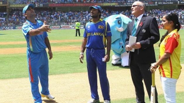 MUMBAI, INDIA - APRIL 02: MS Dhoni of India tosses the coin for the second time with Kumar Sangakkara of Sri Lanka looking on during the 2011 ICC World Cup Final between India and Sri Lanka at Wankhede Stadium on April 2, 2011 in Mumbai, India. (Photo by Hamish Blair/Getty Images) (Getty Images) MUMBAI, INDIA - APRIL 02: MS Dhoni of India tosses the coin for the second time with Kumar Sangakkara of Sri Lanka looking on during the 2011 ICC World Cup Final between India and Sri Lanka at Wankhede Stadium on April 2, 2011 in Mumbai, India. (Photo by Hamish Blair/Getty Images) (Getty Images)