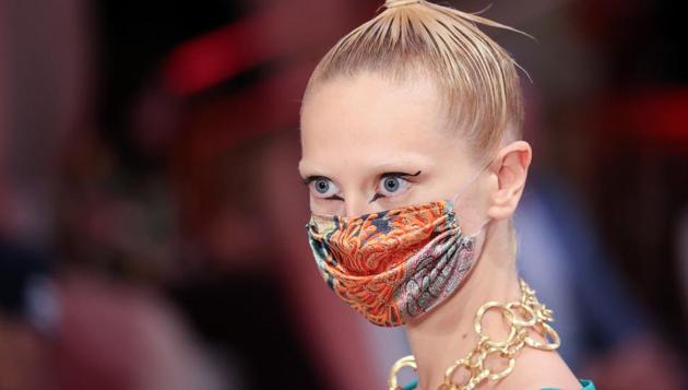 A model wears a face mask as she presents creations of the 2021 summer collection by designer Anja Gockel at Adlon Hotel, following the coronavirus disease (COVID-19) outbreak in Berlin, Germany, June 30, 2020. (REUTERS) A model wears a face mask as she presents creations of the 2021 summer collection by designer Anja Gockel at Adlon Hotel, following the coronavirus disease (COVID-19) outbreak in Berlin, Germany, June 30, 2020. (REUTERS)