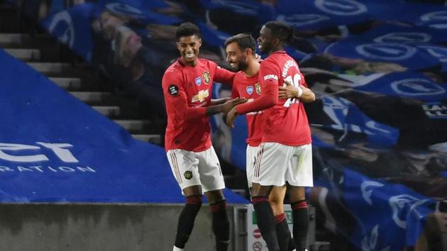 Manchester United's Bruno Fernandes celebrates scoring their third goal with teammates. (REUTERS) Manchester United's Bruno Fernandes celebrates scoring their third goal with teammates. (REUTERS)