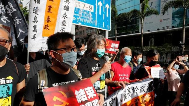 Pro-democracy protesters march during a demonstration near a flag raising ceremony on the anniversary of Hong Kong's handover to China in Hong Kong on July 1 2020. (Reuters Photo) Pro-democracy protesters march during a demonstration near a flag raising ceremony on the anniversary of Hong Kong's handover to China in Hong Kong on July 1 2020. (Reuters Photo)