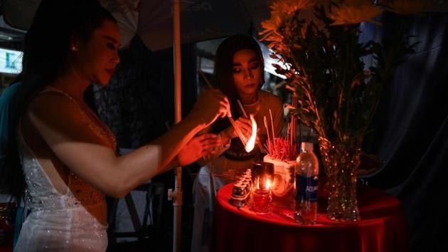 Transgender performer La Kim Quyen (L) burns incense sticks before the start of a lotto show in Ho Chi Minh City. In schools, misinformation about sexual orientation and gender identity is rife and some children are taught by both teachers and parents that homosexuality is a mental illness, according to a Human Rights Watch report published this year. (Manan VATSYAYANA / AFP) Transgender performer La Kim Quyen (L) burns incense sticks before the start of a lotto show in Ho Chi Minh City. In schools, misinformation about sexual orientation and gender identity is rife and some children are taught by both teachers and parents that homosexuality is a mental illness, according to a Human Rights Watch report published this year. (Manan VATSYAYANA / AFP)