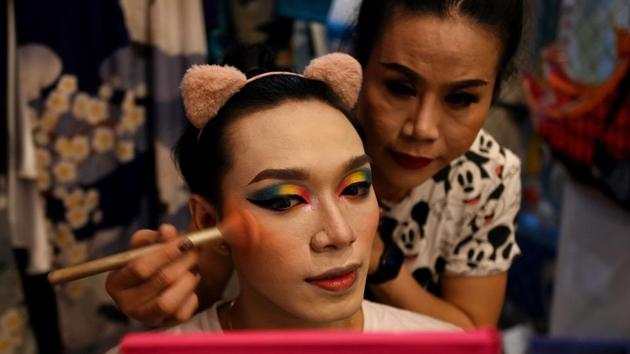 LGBT performers getting ready backstage before the start of a lotto show in Ho Chi Minh City. According to a report by AFP, much of the audience at the shows in Ho Chi Minh City and next door Binh Duong province is young, and view the rainbow of swishing gowns through their phone screens. (Manan VATSYAYANA / AFP) LGBT performers getting ready backstage before the start of a lotto show in Ho Chi Minh City. According to a report by AFP, much of the audience at the shows in Ho Chi Minh City and next door Binh Duong province is young, and view the rainbow of swishing gowns through their phone screens. (Manan VATSYAYANA / AFP)