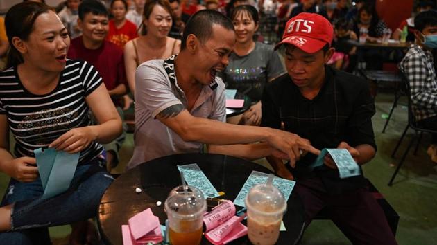 Patrons during a game of lotto conducted by the LGBT LoTo troupe in Ho Chi Minh City. Vietnam is seen as relatively progressive on LGBT issues -- the one-party state lifted a ban on same-sex marriage in 2015 -- although it stopped short of full legal recognition for the unions and a long-promised transgender law to allow legal gender changes has not yet materialised. (Manan VATSYAYANA / AFP) Patrons during a game of lotto conducted by the LGBT LoTo troupe in Ho Chi Minh City. Vietnam is seen as relatively progressive on LGBT issues -- the one-party state lifted a ban on same-sex marriage in 2015 -- although it stopped short of full legal recognition for the unions and a long-promised transgender law to allow legal gender changes has not yet materialised. (Manan VATSYAYANA / AFP)