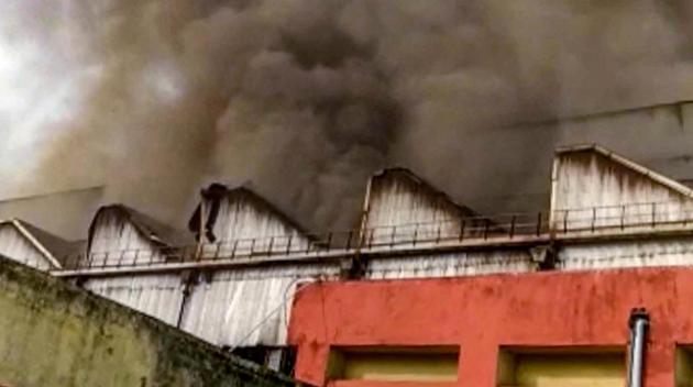 Smoke rises in the sky from the building of Rail wheel factory after a blast, at Bela in Saran district, Wednesday,(PTI)