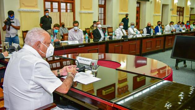 Karnataka chief minister B S Yediyurappa chairs a meeting with experts and senior officers to discuss ways forward in Covid-19 management, in Bengaluru on Wednesday. (PTI Photo) Karnataka chief minister B S Yediyurappa chairs a meeting with experts and senior officers to discuss ways forward in Covid-19 management, in Bengaluru on Wednesday. (PTI Photo)
