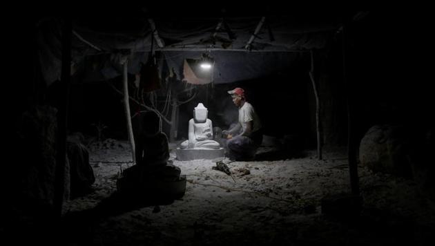 A marble carver works on a statue of a Buddha in his carving workshop in Sagyin, Mandalay, Myanmar, February 13, 2019. (REUTERS/Ann Wang) A marble carver works on a statue of a Buddha in his carving workshop in Sagyin, Mandalay, Myanmar, February 13, 2019. (REUTERS/Ann Wang)