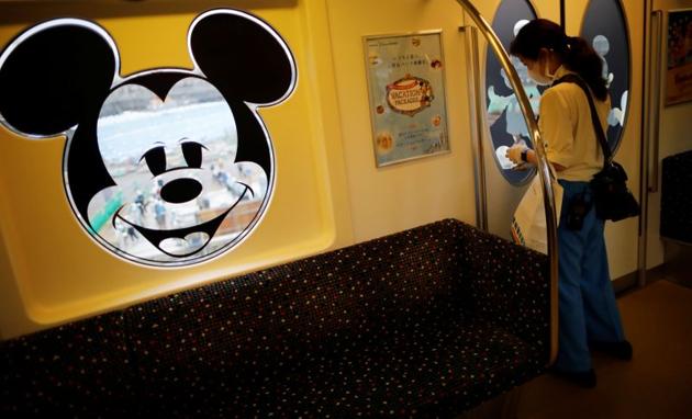 A staff member disinfects a Disney Resort line train during the reopening of Tokyo Disneyland along with Tokyo DisneySea, which closed for months due to the coronavirus disease (COVID-19) outbreak, in Urayasu, east of Tokyo, Japan July 1, 2020. (REUTERS) A staff member disinfects a Disney Resort line train during the reopening of Tokyo Disneyland along with Tokyo DisneySea, which closed for months due to the coronavirus disease (COVID-19) outbreak, in Urayasu, east of Tokyo, Japan July 1, 2020. (REUTERS)