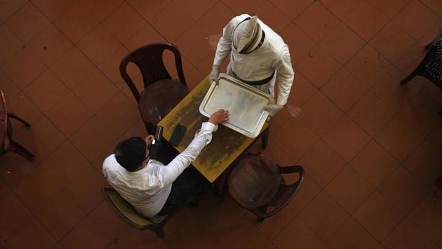 Even though there are seating arrangements both on the ground floor and on the first floor, as of now only 25 tables instead of the usual 50 have been arranged on the first floor. The first floor hasn’t been reopened yet. (Samir Jana / HT Photo)