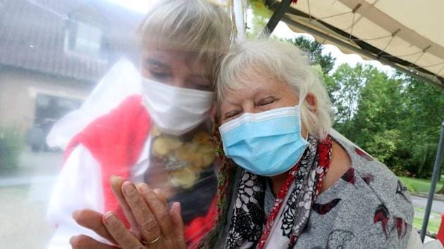 Lily Hendrickx, 83, a resident at Belgian nursing home "Le Jardin de Picardie" enjoy hugs and cuddles with Marie-Christine Desoer, the director of the residence, in Peruwelz, Belgium July 1, 2020. (REUTERS) Lily Hendrickx, 83, a resident at Belgian nursing home "Le Jardin de Picardie" enjoy hugs and cuddles with Marie-Christine Desoer, the director of the residence, in Peruwelz, Belgium July 1, 2020. (REUTERS)