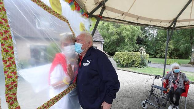 Albert Letellier, 86, a resident at Belgian nursing home "Le Jardin de Picardie" enjoy hugs and cuddles with Marie-Christine Desoer, the director of the residence, in Peruwelz, Belgium July 1, 2020. (REUTERS) Albert Letellier, 86, a resident at Belgian nursing home "Le Jardin de Picardie" enjoy hugs and cuddles with Marie-Christine Desoer, the director of the residence, in Peruwelz, Belgium July 1, 2020. (REUTERS)