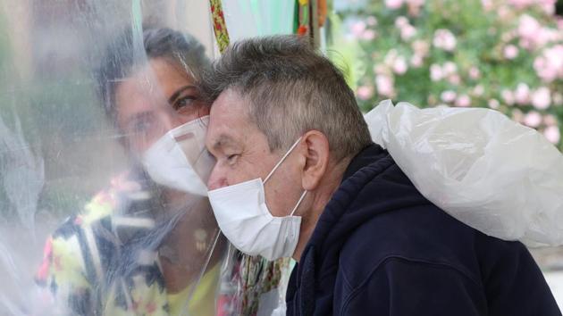 Richard Josefiak, 63, a resident at Belgian nursing home "Le Jardin de Picardie" enjoy hugs and cuddles with his daughter Amandine Josefiak in Peruwelz, Belgium July 1, 2020. (REUTERS) Richard Josefiak, 63, a resident at Belgian nursing home "Le Jardin de Picardie" enjoy hugs and cuddles with his daughter Amandine Josefiak in Peruwelz, Belgium July 1, 2020. (REUTERS)