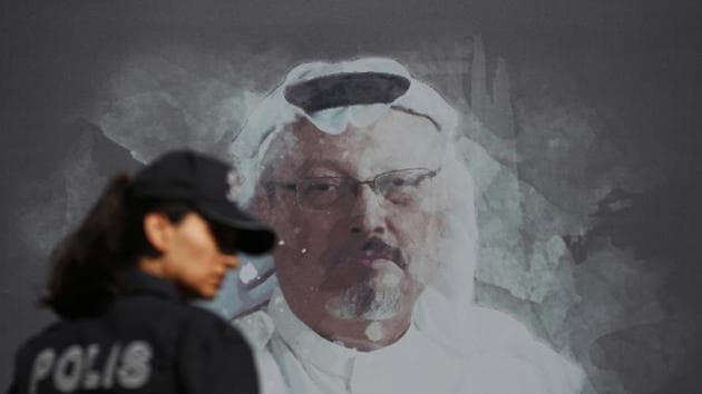 A Turkish police officer walks past a picture of slain Saudi journalist Jamal Khashoggi prior to a ceremony, near the Saudi Arabia consulate in Istanbul, marking the one-year anniversary of his death. (AP) A Turkish police officer walks past a picture of slain Saudi journalist Jamal Khashoggi prior to a ceremony, near the Saudi Arabia consulate in Istanbul, marking the one-year anniversary of his death. (AP)