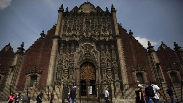 Pedestrians wearing protective face masks as a precaution against the new coronavirus walk past Metropolitan Cathedral situated on the Zocalo, the main plaza of Mexico City on July 2. According to a report by Reuters, the new figure also pushed Mexico past Iran to 10th place among nations with the largest number of cases. (Fernando Llano / AP) Pedestrians wearing protective face masks as a precaution against the new coronavirus walk past Metropolitan Cathedral situated on the Zocalo, the main plaza of Mexico City on July 2. According to a report by Reuters, the new figure also pushed Mexico past Iran to 10th place among nations with the largest number of cases. (Fernando Llano / AP)