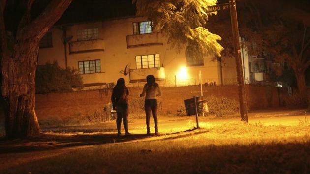 Sex workers wait for clients in the red light district of Harare, Zimbabwe, Friday, June 12, 2020. As the coronavirus spreads in Africa, it increasingly threatens those who earn their living on the streets, including sex workers with HIV. (Associated Press) Sex workers wait for clients in the red light district of Harare, Zimbabwe, Friday, June 12, 2020. As the coronavirus spreads in Africa, it increasingly threatens those who earn their living on the streets, including sex workers with HIV. (Associated Press)