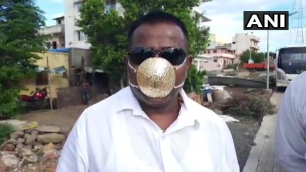 The image shows Shankar Kurade, a resident of Pune, wearing a gold mask.(Twitter/ANI)