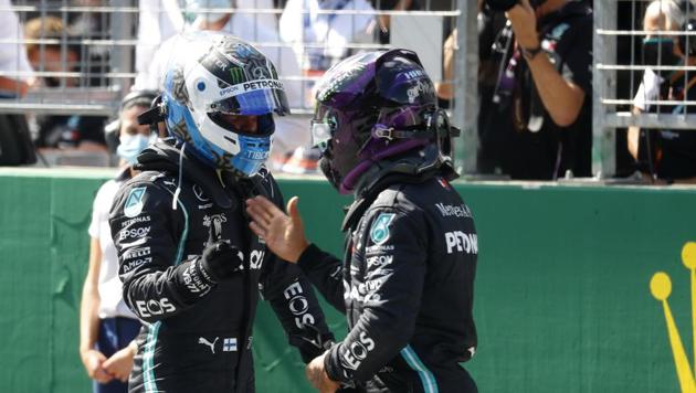 Mercedes driver Valtteri Bottas of Finland, left, celebrates after he clocked the fastest time with second placed Mercedes driver Lewis Hamilton of Britain during the qualifying session at the Red Bull Ring racetrack in Spielberg, Austria. (AP) Mercedes driver Valtteri Bottas of Finland, left, celebrates after he clocked the fastest time with second placed Mercedes driver Lewis Hamilton of Britain during the qualifying session at the Red Bull Ring racetrack in Spielberg, Austria. (AP)