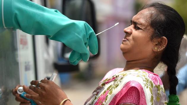 A woman gets her sample collected for COVID-19 swab testing at a medical camp in Chennai on June 29. Tamil Nadu on July 3 became the second state in India to cross one lakh cases, with a total of 102,721 people infected with Covid-19 disease, reported HT. (PTI)