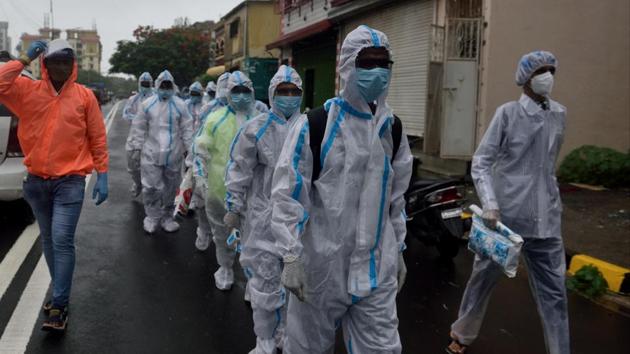 A BMC health care team on its way to conduct door-to-door medical checkup at Malvani in Mumbai’s Malad area on Saturday. (Satish Bate/HT Photo) A BMC health care team on its way to conduct door-to-door medical checkup at Malvani in Mumbai’s Malad area on Saturday. (Satish Bate/HT Photo)