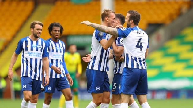 Brighton & Hove Albion's Dan Burn and teammates celebrate after the matchase contact your account representative for further details.(REUTERS)