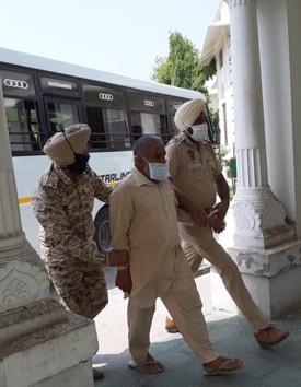 Hours after the arrest of seven dera followers, the Khatra-led SIT produced the accused in a Faridkot court on Saturday afternoon and sought their police custody for investigation.(HT Photo)