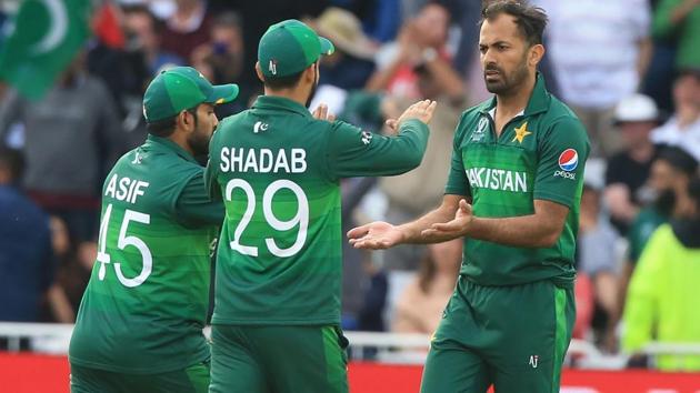 Pakistan's Wahab Riaz (R) celebrates with teammates(AFP)