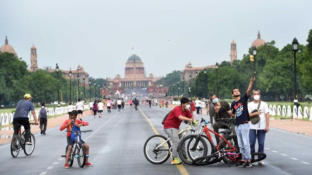 Cyclists seen at Rajpath after rain showers in New Delhi, India. As of Sunday, there are over 25,000 active cases in Delhi. (Arvind Yadav/HT PHOTO) Cyclists seen at Rajpath after rain showers in New Delhi, India. As of Sunday, there are over 25,000 active cases in Delhi. (Arvind Yadav/HT PHOTO)