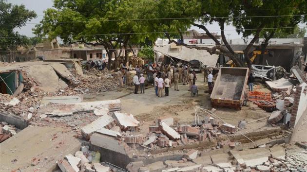 Debris lie on the ground following the demolition of the residence of criminal Vikay Dubey, after an encounter in Bikaru village where 8 police personnel lost their lives, in Kanpur on Saturday. (PTI Photo) Debris lie on the ground following the demolition of the residence of criminal Vikay Dubey, after an encounter in Bikaru village where 8 police personnel lost their lives, in Kanpur on Saturday. (PTI Photo)