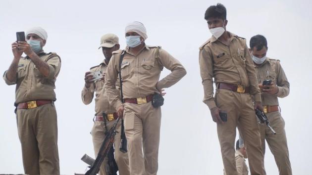 Police personnel at the residence of criminal Vikas Dubey, after an encounter in Bikaru village where 8 police personnel lost their lives, in Kanpur. (PTI) Police personnel at the residence of criminal Vikas Dubey, after an encounter in Bikaru village where 8 police personnel lost their lives, in Kanpur. (PTI)