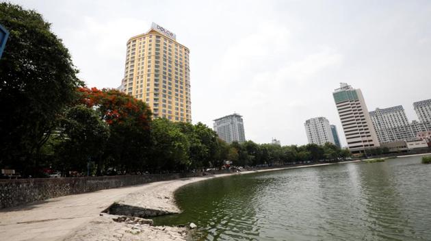 A view of the newly-inaugurated Dolce Hanoi Golden Lake hotel (L), which features gold plated exteriors and interiors, after the government eased a nationwide lockdown following the global outbreak of the coronavirus disease (COVID-19), in Hanoi, Vietnam. (REUTERS/Kham)