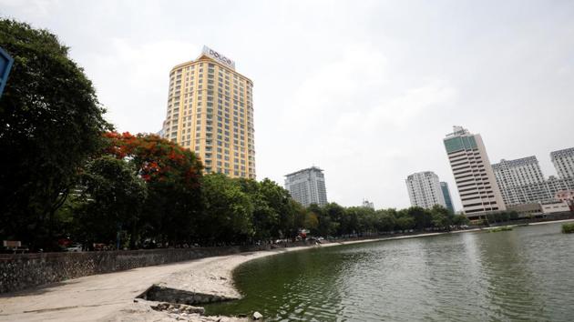 A view of the newly-inaugurated Dolce Hanoi Golden Lake hotel (L), which features gold plated exteriors and interiors, after the government eased a nationwide lockdown following the global outbreak of the coronavirus disease (COVID-19), in Hanoi, Vietnam.(REUTERS/Kham) A view of the newly-inaugurated Dolce Hanoi Golden Lake hotel (L), which features gold plated exteriors and interiors, after the government eased a nationwide lockdown following the global outbreak of the coronavirus disease (COVID-19), in Hanoi, Vietnam.(REUTERS/Kham)