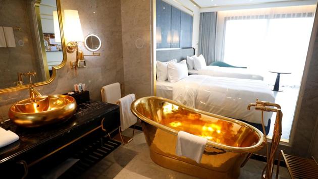 A gold plated bathtub and a gold plated bathroom sink are seen in the newly-inaugurated Dolce Hanoi Golden Lake luxury hotel, after the government eased a nationwide lockdown following the global outbreak of the coronavirus disease (COVID-19), in Hanoi, Vietnam. (REUTERS/Kham)