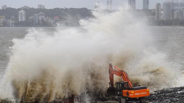 Waves crash ashore during high tide, at Marine Drive promenade in Mumbai, Sunday, July 5, 2020. (PTI)