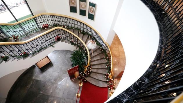 A dancer walks down the stair at the newly inaugurated Dolce Hanoi Golden Lake luxury hotel, after the government eased a nationwide lockdown following the global outbreak of the coronavirus disease (COVID-19), in Hanoi, Vietnam. (REUTERS/Kham)