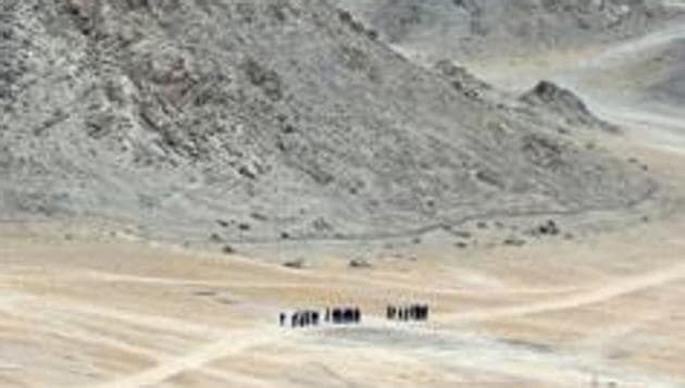 Indian soldiers walk at the foothills of a mountain range near Leh, the joint capital of the union territory of Ladakh, on June 24, 2020. - Indian fighter jets roared over the Indian Himalayan town of Leh on June 24 reinforcing simmering border tensions with China that military sources say has taken over a chunk of territory that India considers its own. (Photo by Tauseef MUSTAFA / AFP)(AFP file photo. Representative image)