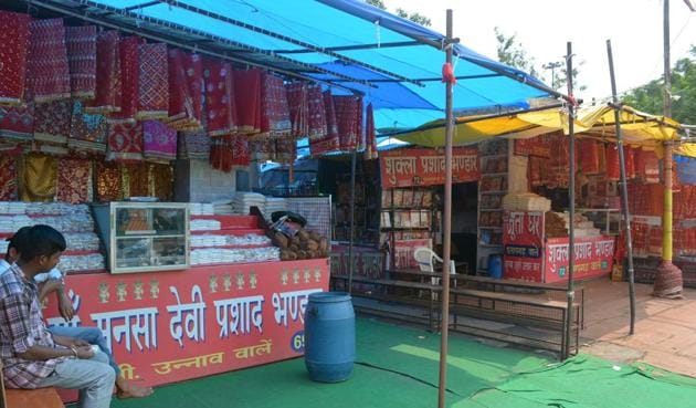 Prasad stalls have no takers due to the ban on bringing the offering inside the temple. (Sant Arora/HT) Prasad stalls have no takers due to the ban on bringing the offering inside the temple. (Sant Arora/HT)