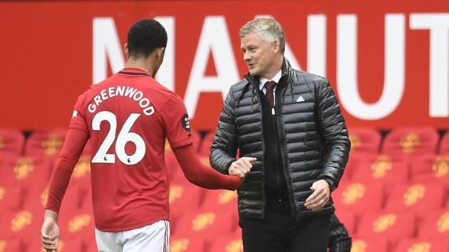 Manchester United manager Ole Gunnar Solskjaer substitutes off Manchester United's Mason Greenwood.(REUTERS)