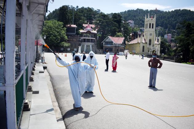 The Ridge being sanitised by health workers in Shimla. Additional chief secretary (health) RD Dhiman has urged people of the state to observe all precautions to combat coronavirus during the unlock period. He said as economic and tourism activities pick up, it’s all the more important to stay alert. (Deepak Sansta/HT) The Ridge being sanitised by health workers in Shimla. Additional chief secretary (health) RD Dhiman has urged people of the state to observe all precautions to combat coronavirus during the unlock period. He said as economic and tourism activities pick up, it’s all the more important to stay alert. (Deepak Sansta/HT)