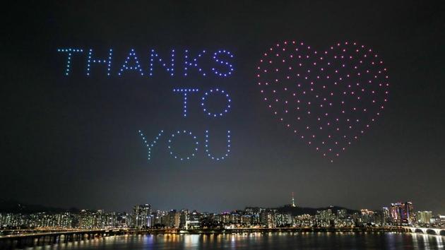 Drones fly over the Han river showing messages to support the country as a measure to avoid the spread of the coronavirus disease.(REUTERS/Yonhap) Drones fly over the Han river showing messages to support the country as a measure to avoid the spread of the coronavirus disease.(REUTERS/Yonhap)