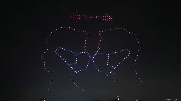 Drones fly over the Han river showing messages to support the country, as measures to avoid the spread of the coronavirus disease (Covid-19) continue, in Seoul, South Korea, July 4, 2020. (REUTERS/Yonhap)