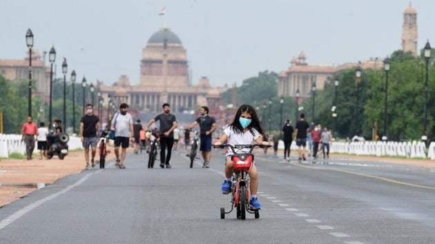 New Delhi, India - July 5, 2020: A girl rides a bicycle at Rajpath after rain showers in New Delhi, India, on Sunday, July 5, 2020.(Arvind Yadav/HT PHOTO) New Delhi, India - July 5, 2020: A girl rides a bicycle at Rajpath after rain showers in New Delhi, India, on Sunday, July 5, 2020.(Arvind Yadav/HT PHOTO)