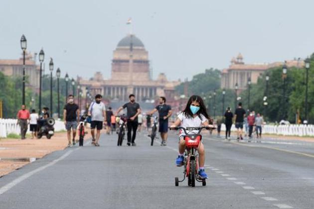 A girl rides a bicycle at Rajpath after rain showers in New Delhi, India, on Sunday. (Arvind Yadav/HT PHOTO) A girl rides a bicycle at Rajpath after rain showers in New Delhi, India, on Sunday. (Arvind Yadav/HT PHOTO)
